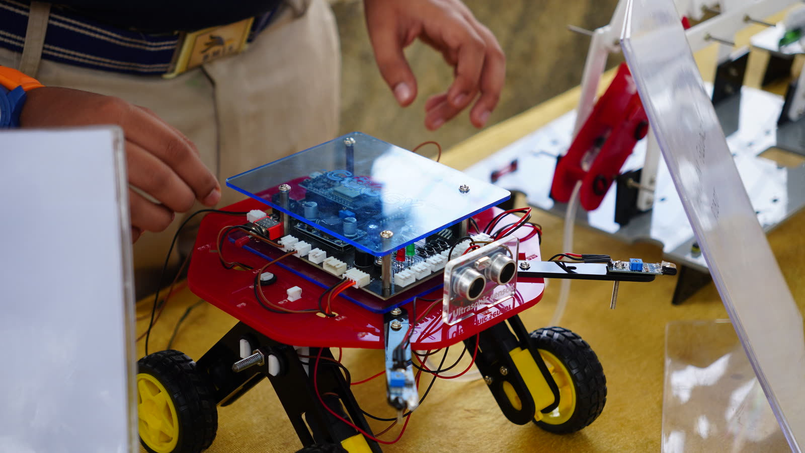 Close-up of a student-built rover robot with ultrasonic sensor