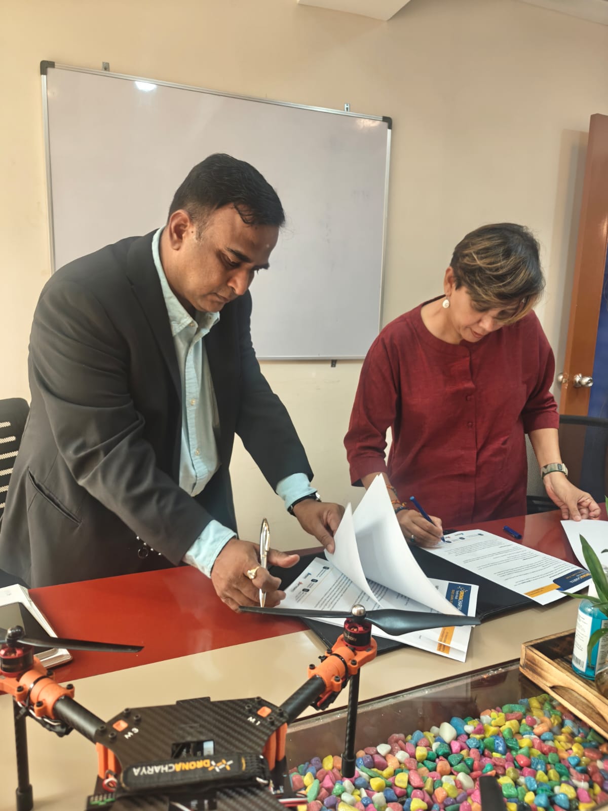 MOU documents being signed at the Dronacharya Tech Hub office