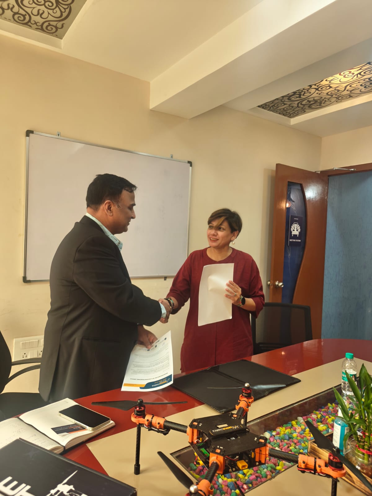 A handshake sealing the GNR Robotics and Dronacharya Tech Hub partnership